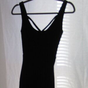 Collectif bodycon black dress with crossed strap styling.